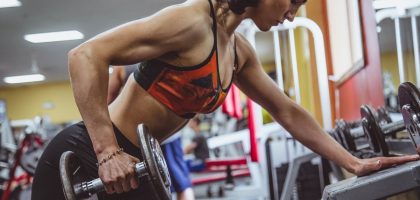 woman seriously performing gym exercise