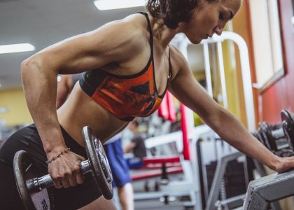 woman seriously performing gym exercise